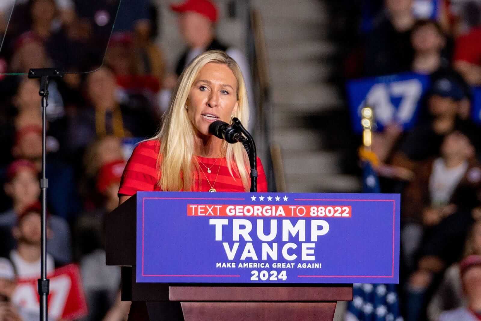 Marjorie Taylor Greene behind a Trump-Vance podium_ Image by Phil Mistry via Shutterstock_